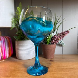 Single glass or pair of beautiful hand decorated bright blue and silver or gold glitter gin glasses