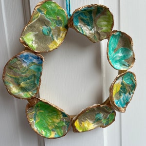 Decoupaged oyster shell wreath