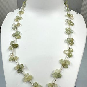 Aquamarine faceted pear with metal lock strand 9mm to 12mm one line strand 20 inch ,weight 160ct one line weight Faceted gemstone
