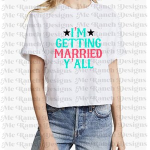 May include: White cropped t-shirt with the text "I'M GETTING MARRIED Y'ALL" in turquoise and pink lettering.