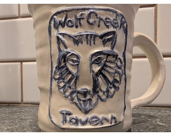 Wolf Creek Tavern Ceramic Mug Handcrafted Art Embossed Wolf Design 1980 OREGON