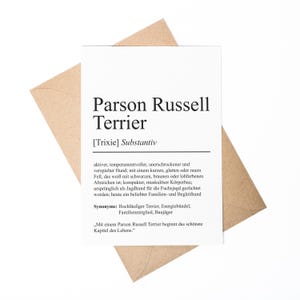 Könnte beinhalten: Eine weiße Karte mit schwarzem Text, der die Parson Russell Terrier Rasse definiert. Die Karte enthält den Namen der Rasse, eine Definition, Synonyme und ein Zitat über die Rasse. Die Karte befindet sich auf einem braunen Papierhintergrund.