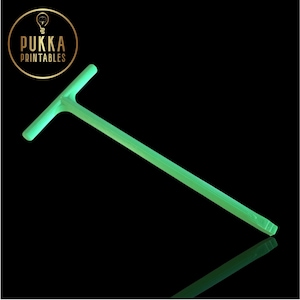 May include: A neon green T-shaped tool against a black background. The tool has a long, straight handle and a shorter, perpendicular bar at the top. The tool is angled diagonally across the frame. The image includes a logo that says "Pukka Printables".