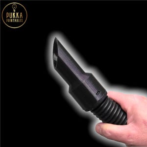 May include: A black 3D-printed nozzle with a beveled tip, held in a hand. The nozzle is connected to a ribbed, flexible tube. The logo "PUKKA PRINTABLES" is in the upper left corner.
