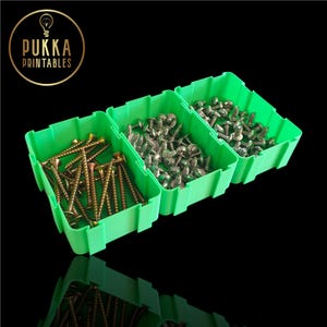 May include: Three bright green plastic storage bins filled with various screws. The bins are arranged side-by-side against a black background. The bins contain different types of screws, including gold and silver-colored screws. The logo "Pukka Printables" is in the upper left corner.