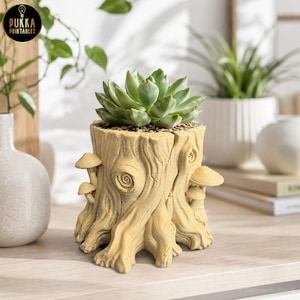May include: A light green succulent plant in a beige tree stump-shaped planter with mushroom accents. The planter has a textured surface and is sitting on a wooden surface. The logo "Pukka Printables" is in the top left corner.