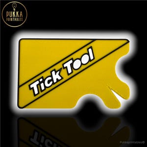 May include: A yellow Tick Tool with black edging and the words "Tick Tool" in white. The tool has a distinctive shape with a handle-like extension. The background is black.