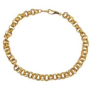May include: A gold-colored chain bracelet with a double-link design. The bracelet is made of a shiny, metallic material and features a clasp closure. The links are round and closely connected, creating a textured appearance. The jewelry is displayed against a white background.