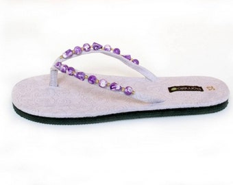 Kids/Girls flip flops with soft microsuede pretty swirl print insole and beaded upper. All sizes Kids UK8-2 Pink or Lilac.