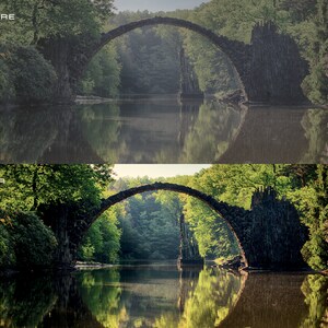 May include: A stone arch bridge over a calm lake with lush green trees and foliage on both sides. The bridge is reflected in the water.