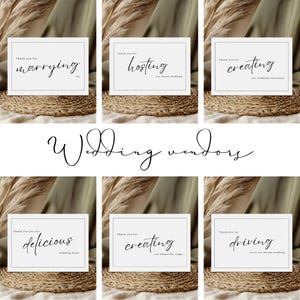 May include: Six white cards with black text on a light brown background. The cards say "Thank you for marrying us", "Thank you for hosting our dream wedding", "Thank you for creating our wedding stationery", "Thank you for our delicious wedding feast", "Thank you for creating our beautiful rings", and "Thank you for driving us to our dream wedding".