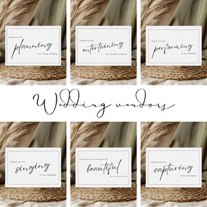 May include: Six white cards with black text on a brown woven surface. The cards thank wedding vendors for planning, entertaining, performing, singing, making the bride feel beautiful, and capturing every moment.