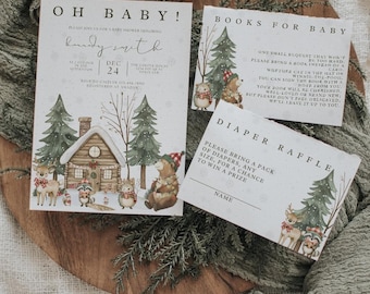 May include: A set of three printed paper cards for a baby shower featuring winter forest illustrations with a cabin, deer, bear, and raccoon. The cards include text for an invitation, a book request, and a diaper raffle entry.