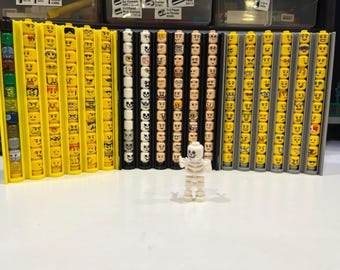 3D Printed LEGO minifig head holder.  Perfect for AFOL / TFOLs!! Includes stud to secure