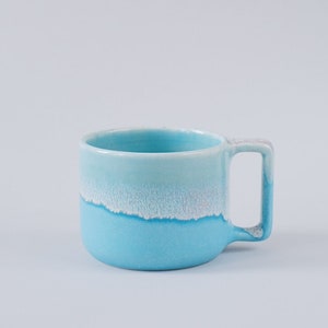 Seafruit: handmade ceramic mug, 300-350 ml, satin blue with floating glossy glaze