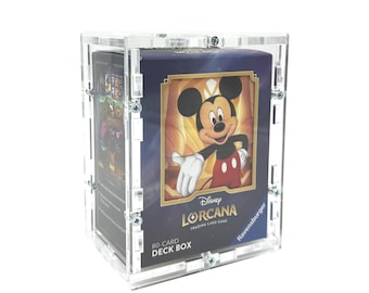 May include: A clear acrylic display case containing a Disney Lorcana trading card game 80-card deck box. The deck box features a graphic of Mickey Mouse, the Disney Lorcana logo, and the Ravensburger brand name on a dark blue background.