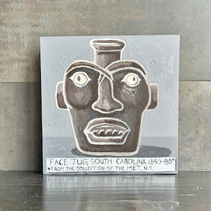 May include: A painting of a brown face jug with white eyes and teeth. The jug is on a gray background with the text "FACE JUG, SOUTH CAROLINA. 1850-80* *FROM THE COLLECTION OF THE MET, N.Y."