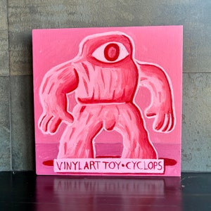 Vinyl Art Toy Cyclops painting by Alan Moyes. Pink cyclops folkart wall art. Porter street studio contemporary art.