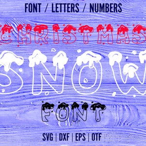 May include: A digital font design with the words "Christmas Snow Font" in a stylized, hand-drawn style. The letters are outlined in white and filled with red and white paint, resembling snow and dripping icicles. The background is a blue woodgrain texture.
