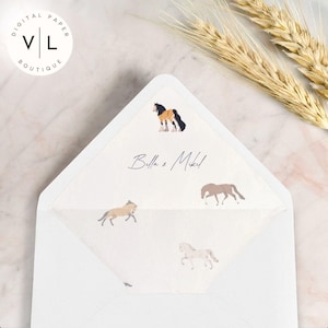 May include: A white envelope with a cream colored inner flap. The inner flap has a pattern of horses in various colors and poses. The text "Bella & Mikel" is written in cursive on the inner flap.