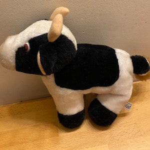 Brown Eyed 1980s Retro Cow with Udders and Horns Soft Plush Toy, Cartoon Eyes. Very sweet cow in excellent condition with label, gift idea