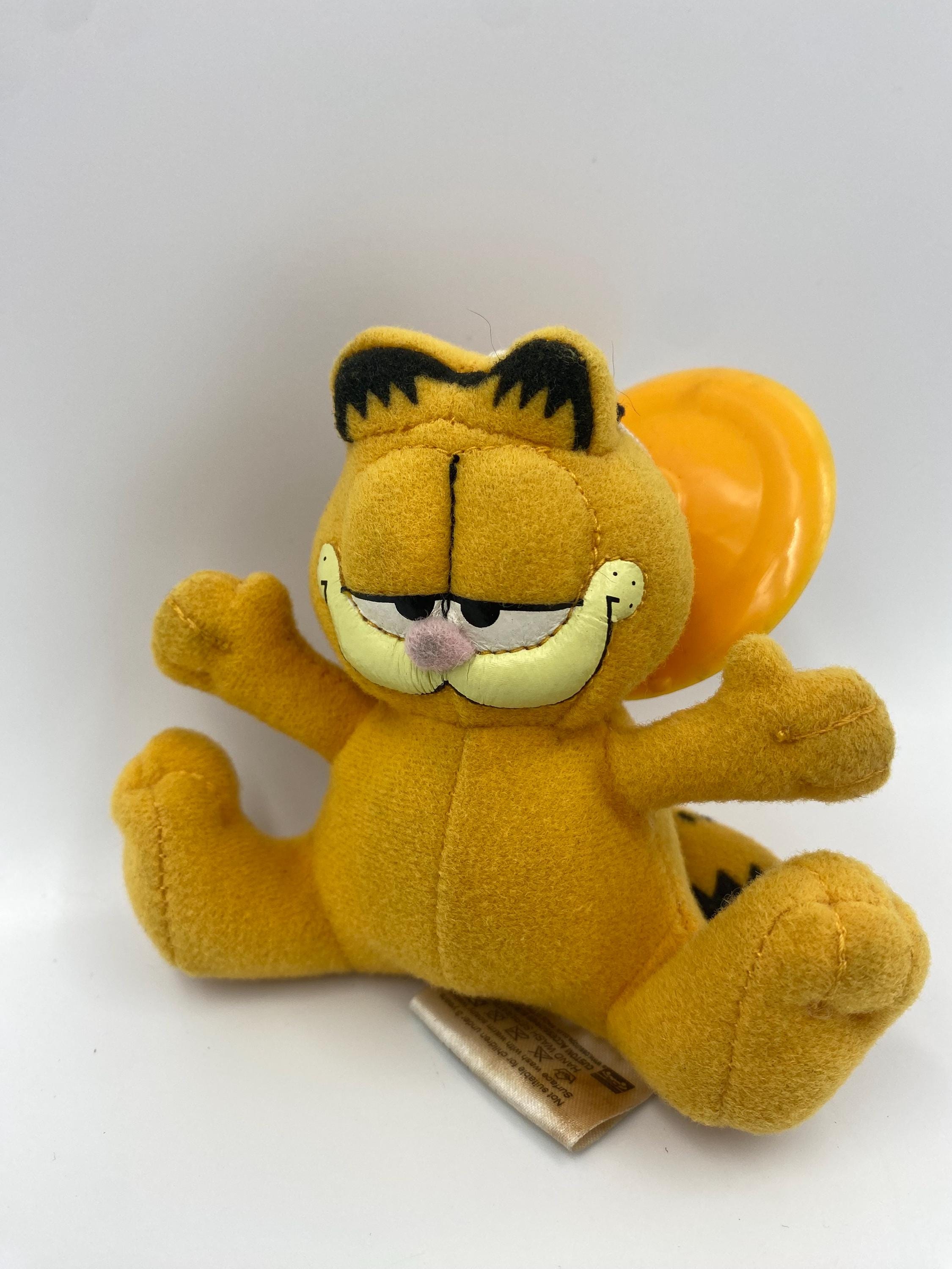 Petite peluche Garfield sur ventouse/tasse de fenêtre de voiture