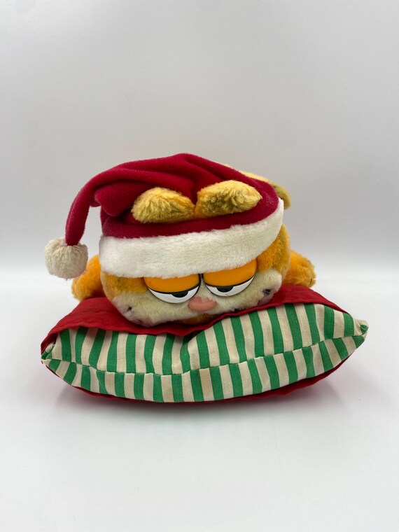 Christmas Garfield Cat Vintage Retro Soft Plush Toy laying on Pillow made by Dakin from 1980s TV Show 1978-1981, United Feature Syndicate