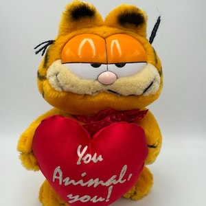 Garfield ‘You Animal You’ holding heart Cat Vintage Retro Soft Plush Toy made by Dakin 1980s TV Show 1978-1981, United Feature Syndicate