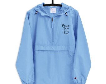 May include: A light blue Champion brand windbreaker jacket with a zipper closure and a black embroidered logo that says "Beaver Pelt Golf Est. 2021".