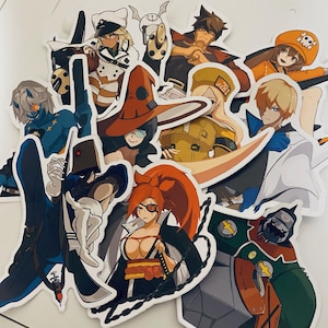May include: A collection of colorful anime character stickers featuring a variety of characters with different hairstyles, clothing, and accessories. The stickers are printed on white paper and have a glossy finish.