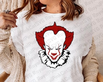 May include: White t-shirt featuring a graphic of a menacing clown with red hair and makeup, a white ruffled collar, and a sinister expression. The text "Digital Download - SVG and PNG" is at the bottom.