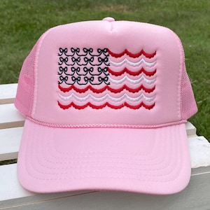 Flaggkeps med rosett, broderad keps med rosettflagga, broderad keps med rosett och vågig amerikansk flagga, keps med rosett och vågig amerikansk flagga, keps med rosett och vågig flagga