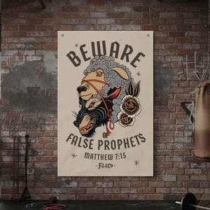 May include: A canvas banner with the text "BEWARE OF FALSE PROPHETS" and an illustration of a wolf in sheep's clothing. The banner is displayed in a gym setting with a brick wall background.