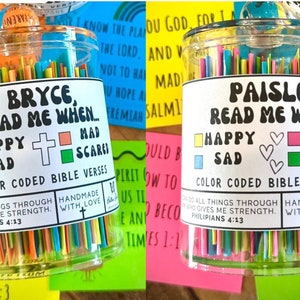 May include: Two clear glass jars filled with colorful paper strips. Each jar has a label with a name, "Bryce" and "Paisley", and the words "Read Me When..." with color-coded squares for happy, sad, mad, and scared. The labels also include the text "Color Coded Bible Verses" and "Handmade with Love".