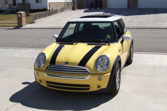 Presented in British Racing Green with Black Bonnet Stripes, this 2021, Mini Coopers