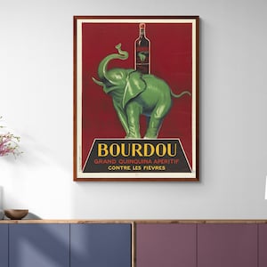 May include: Vintage poster advertising Bourdou Grand Quinquina Aperitif, a red wine drink. The poster features a green elephant standing on its hind legs with a bottle of Bourdou on its back. The text on the poster reads "Bourdou Grand Quinquina Aperitif Contre Les Fievres".