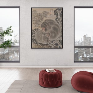 May include: A framed black and white ink painting of a monkey sitting in a cave with a mountain in the background.