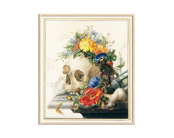 May include: A framed print featuring a skull adorned with a vibrant floral arrangement. The artwork showcases a skull with colorful flowers in shades of yellow, red, blue, and purple. The print is set against a light background and framed in a light wood.