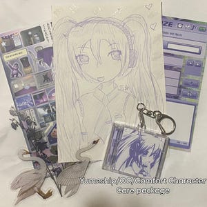 May include: A collection of stationery items including a hand-drawn purple ink sketch of an anime character with twin tails, a square acrylic keychain featuring a matching character illustration, two swan stickers, and a purple-themed sticker sheet.