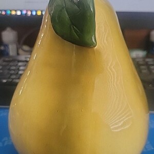 May include: A set of three ceramic mugs with a speckled, matte finish. The mugs are in shades of cream, light gray, and dark gray. Each mug has a simple, minimalist design, perfect for coffee or tea.