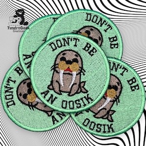 May include: Four green embroidered patches with a walrus cartoon and the text "Don't be an oostik".