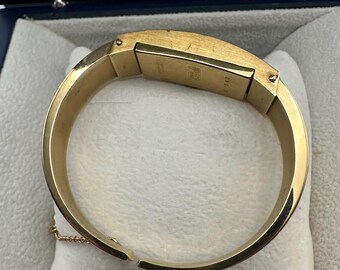 Bucherer, a Rolex Company 18k solid gold peek a boo watch
