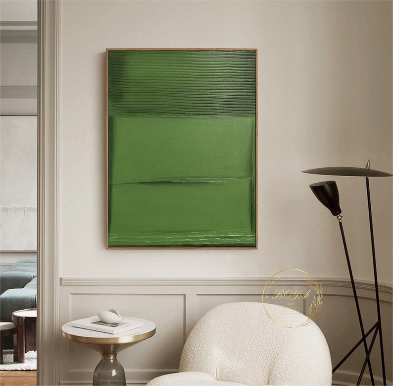 Puede incluir: Pintura abstracta con rayas horizontales verdes y una superficie texturizada. La pintura est&aacute; enmarcada en un marco de madera delgado.