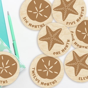 Marcadores y discos de madera para hitos mensuales de bebés, con forma de estrellas de mar y dólares de arena, para recién nacidos o como regalo para baby shower