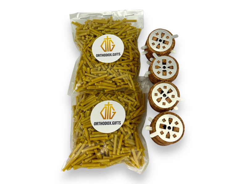 May include: A clear plastic bag filled with yellow beeswax incense sticks. The bag has a white label with the text "ORTHODOX.GIFTS" and a gold cross. Four round cork incense holders with metal cross designs are arranged vertically.