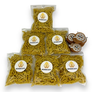 May include: Six bags of yellow beeswax candle wicks, each bag labeled "Orthodox Gifts" with a cross logo.  A separate bag contains five round, wooden candle holders with metal inserts.