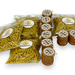 May include: Four bags of yellow incense sticks with the label "ORTHODOX GIFTS" and 24 metal incense burner tops with cork bases.