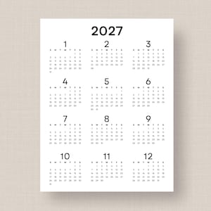 May include: A 2027 yearly calendar printed on a white background with black text. The layout features twelve months arranged in a grid, each labeled with a number from 1 to 12, displaying the days of the week and corresponding dates.
