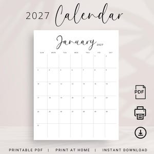 May include: A white ceramic mug with a black handle and the text "But First, Coffee" in a bold, black font. The mug is filled with a dark liquid, likely coffee, and sits on a light-colored surface.