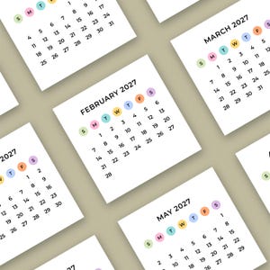 May include: Several white square calendars for 2027, each showing a different month. The calendars have pastel-coloured accents and a clean, modern design. The months of February, March, and May are visible, with the year clearly displayed.